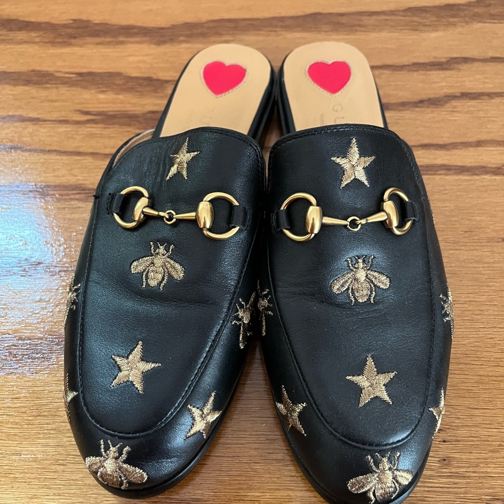 Gucci leather horsebit slip on mules.